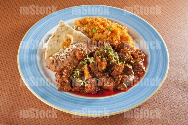 Asado de Puerco con arroz y frijoles